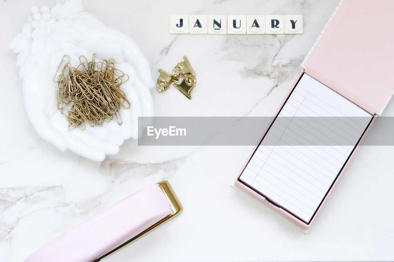 High angle view of january text with office supplies on table