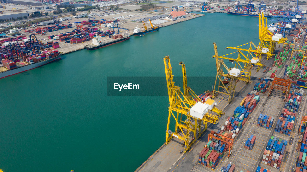 Container ship terminal, and quay crane of container ship at industrial port with shipping container 