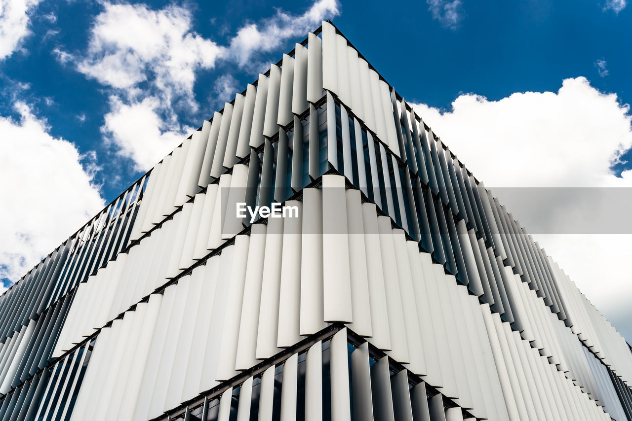 Low angle view of modern building against sky