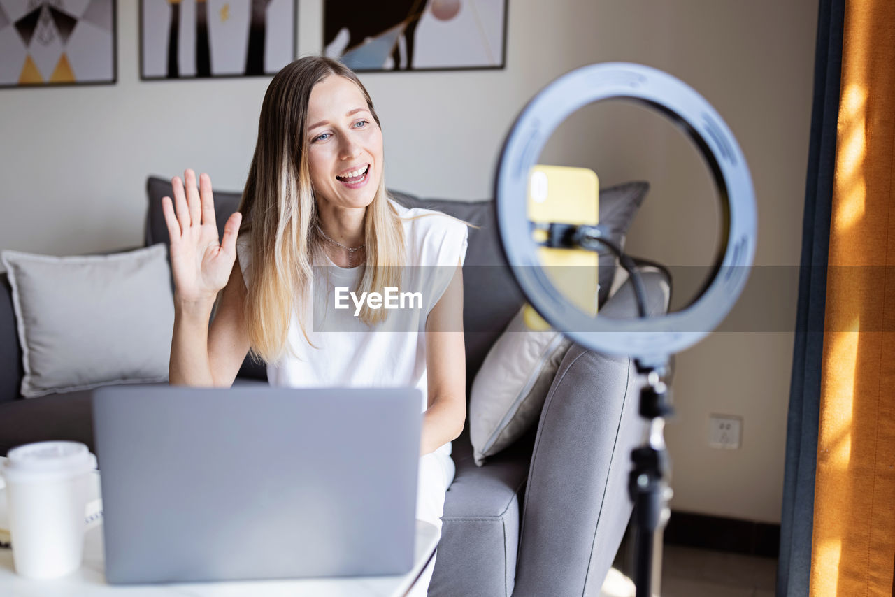 Young woman using laptop at home