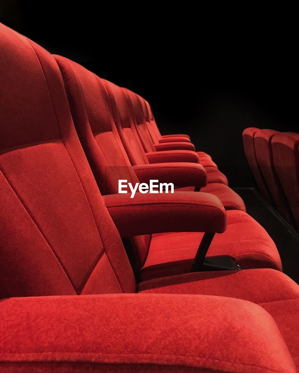 Empty red seats at theater