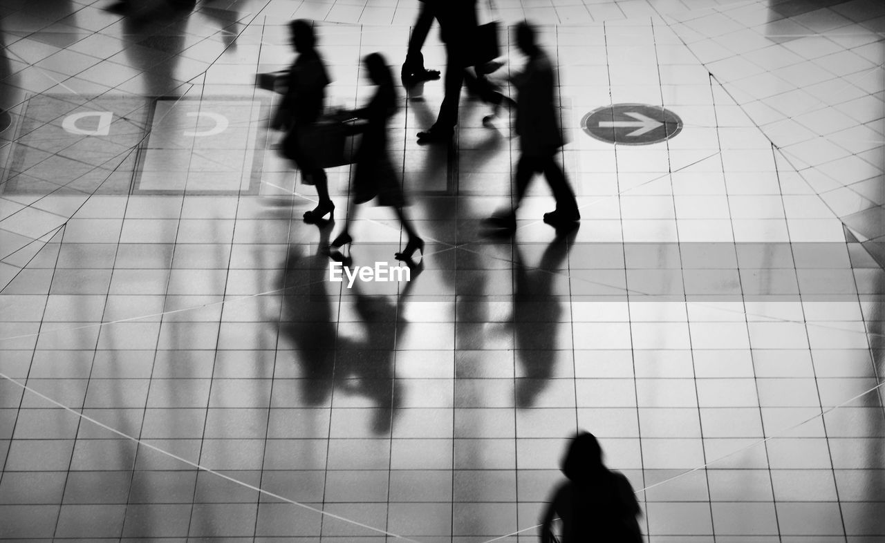 Blurred motion of silhouette people walking at subway station