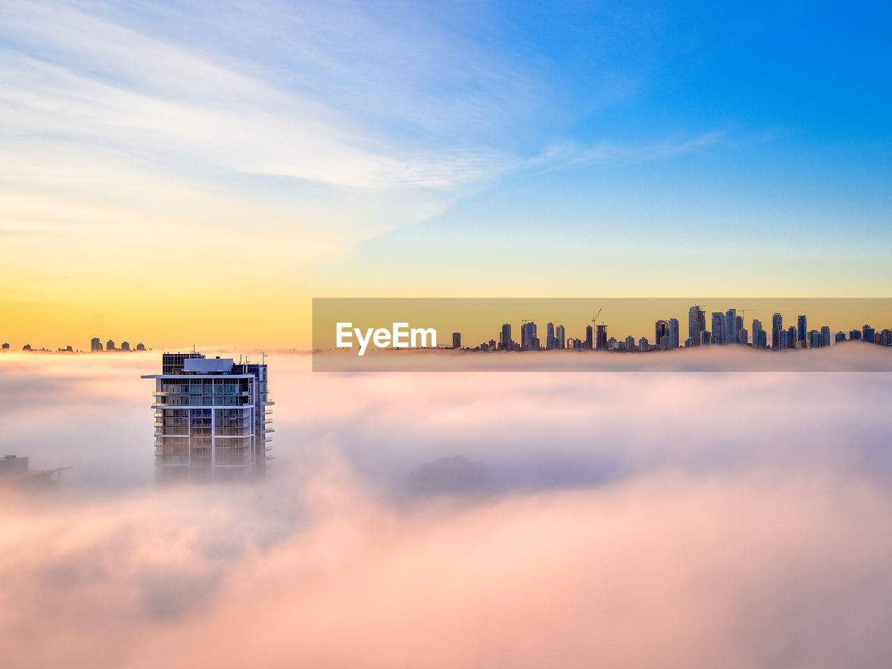 PANORAMIC VIEW OF CITY BUILDINGS AGAINST SKY