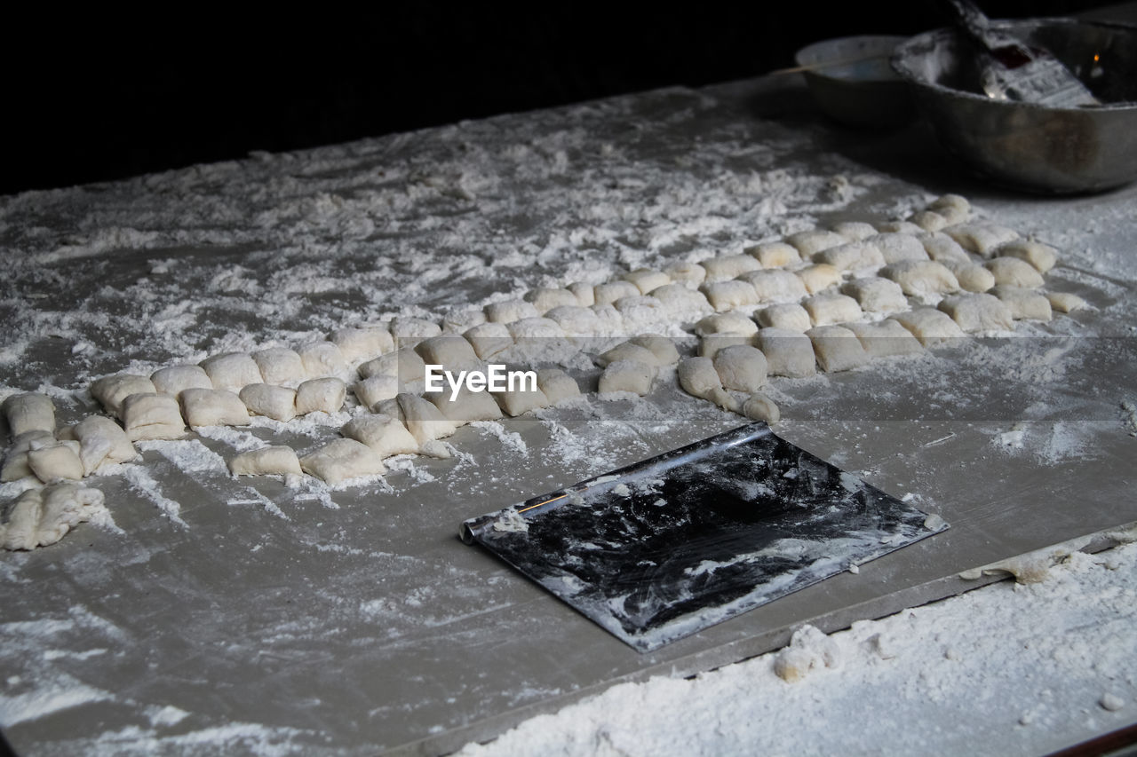 High angle view of prepared dough in the local restaurant ready for cooking