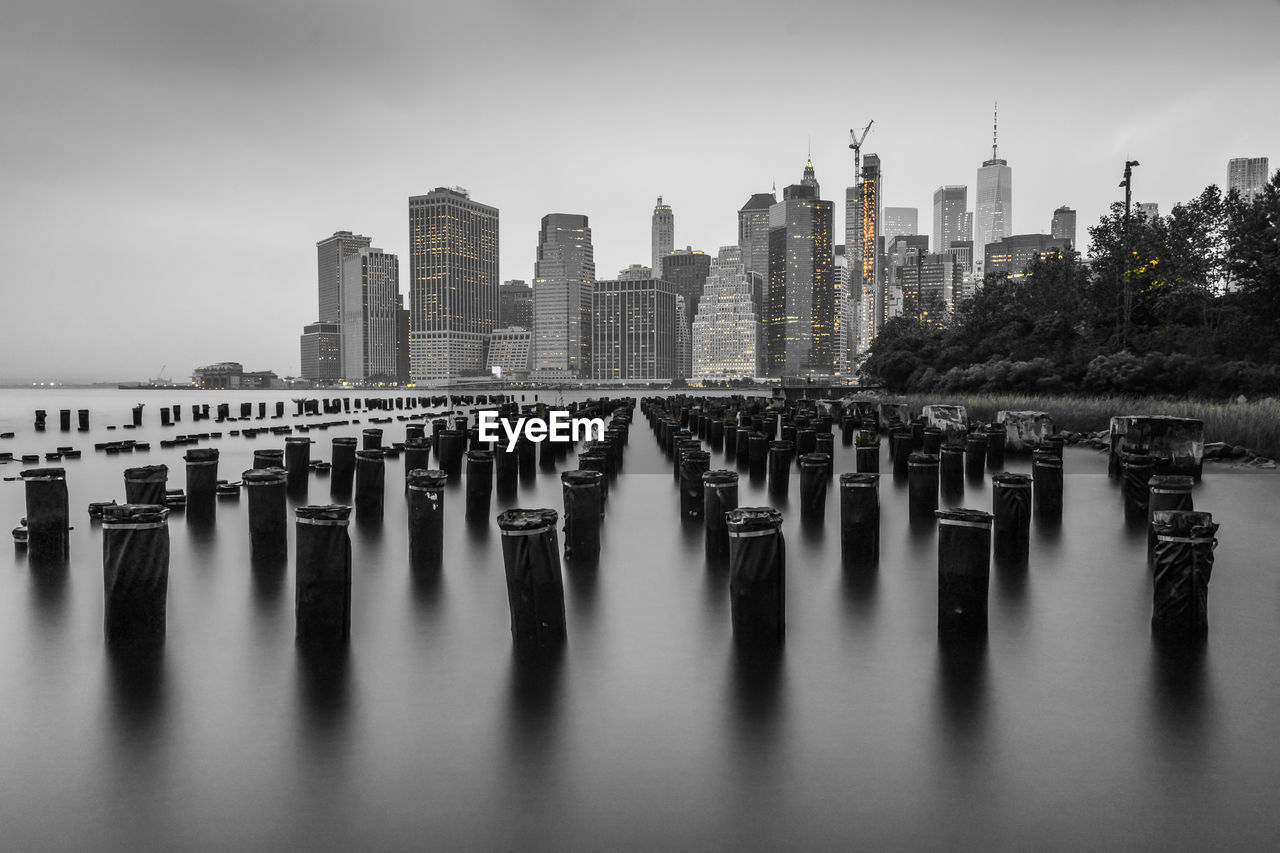 Black and white nyc manhattan from dock side brooklyn