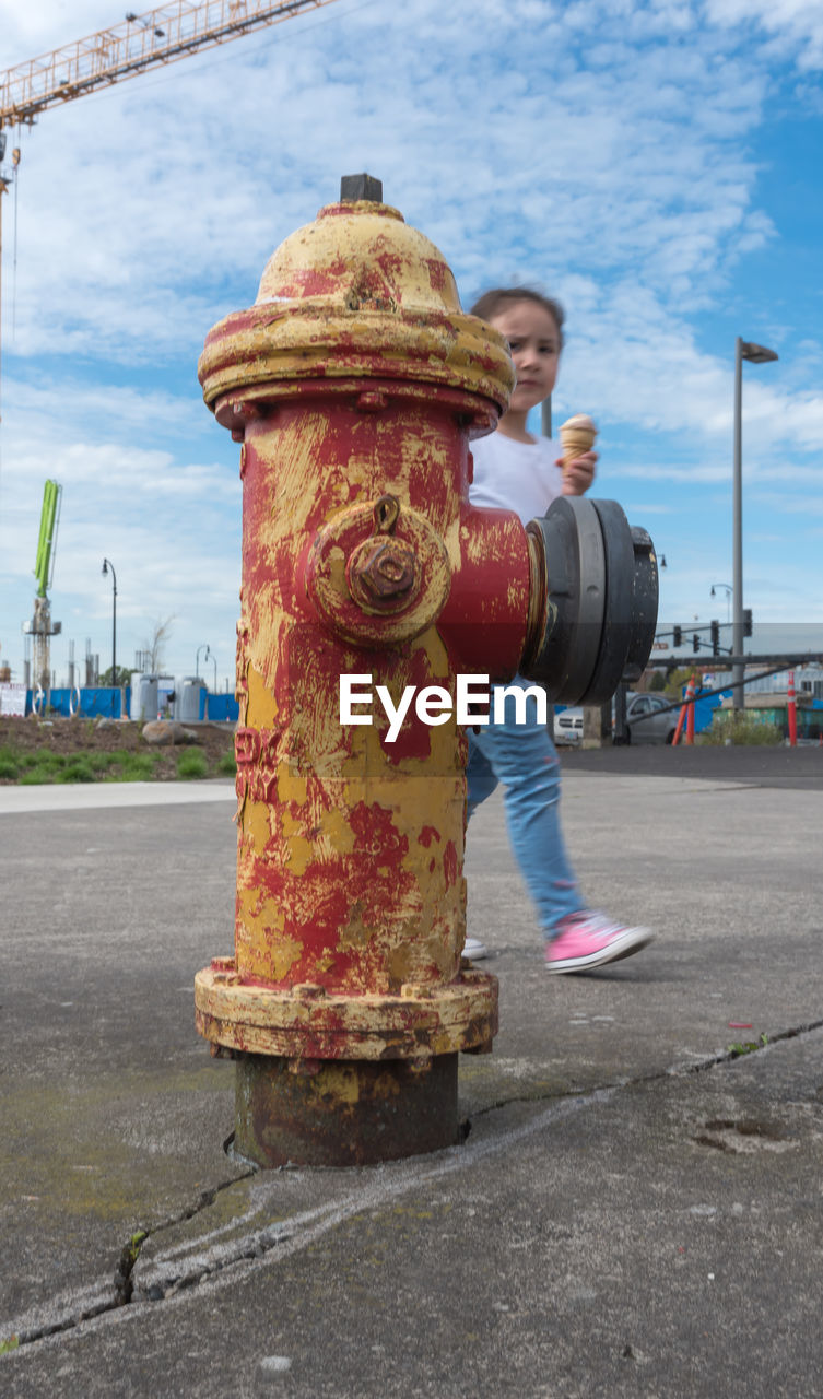 FIRE HYDRANT ON STREET AGAINST SKY