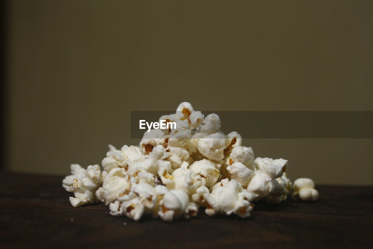 Close-up of popcorn on table