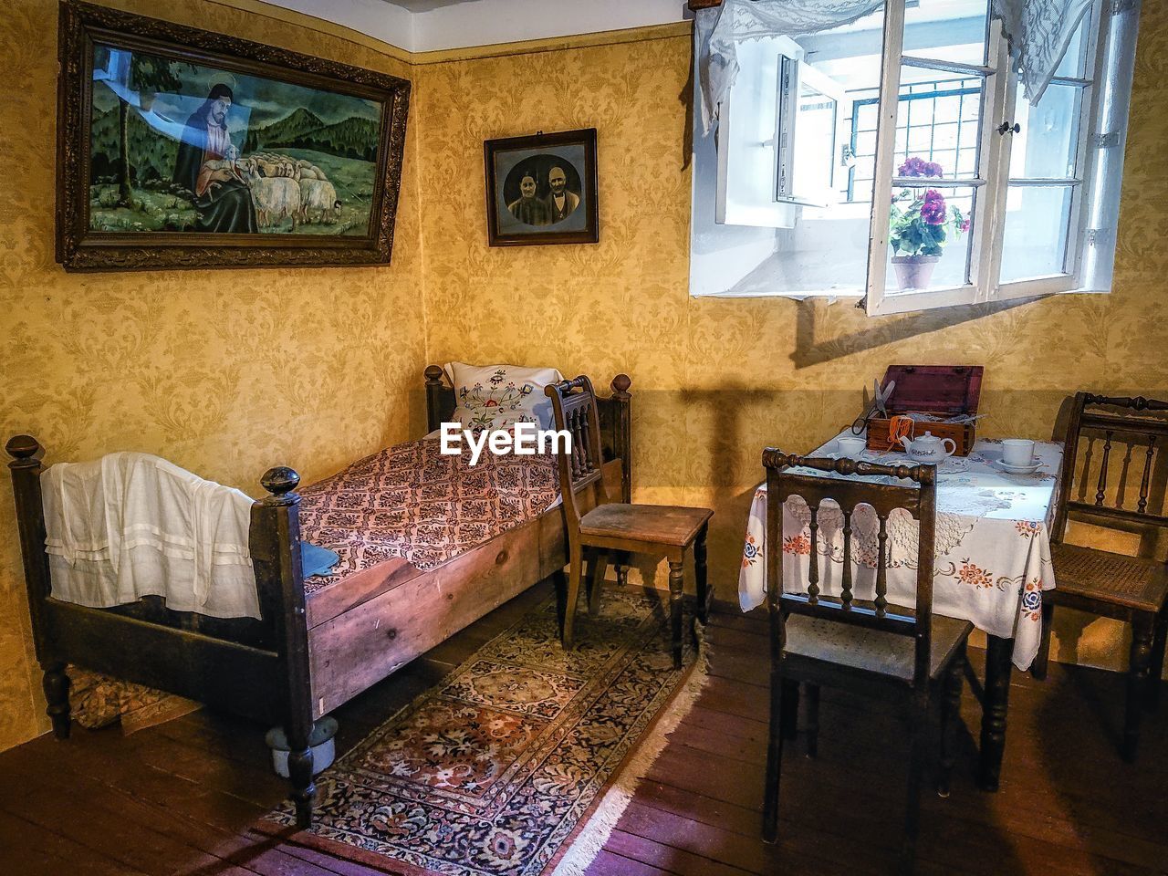 Empty chairs and table in building