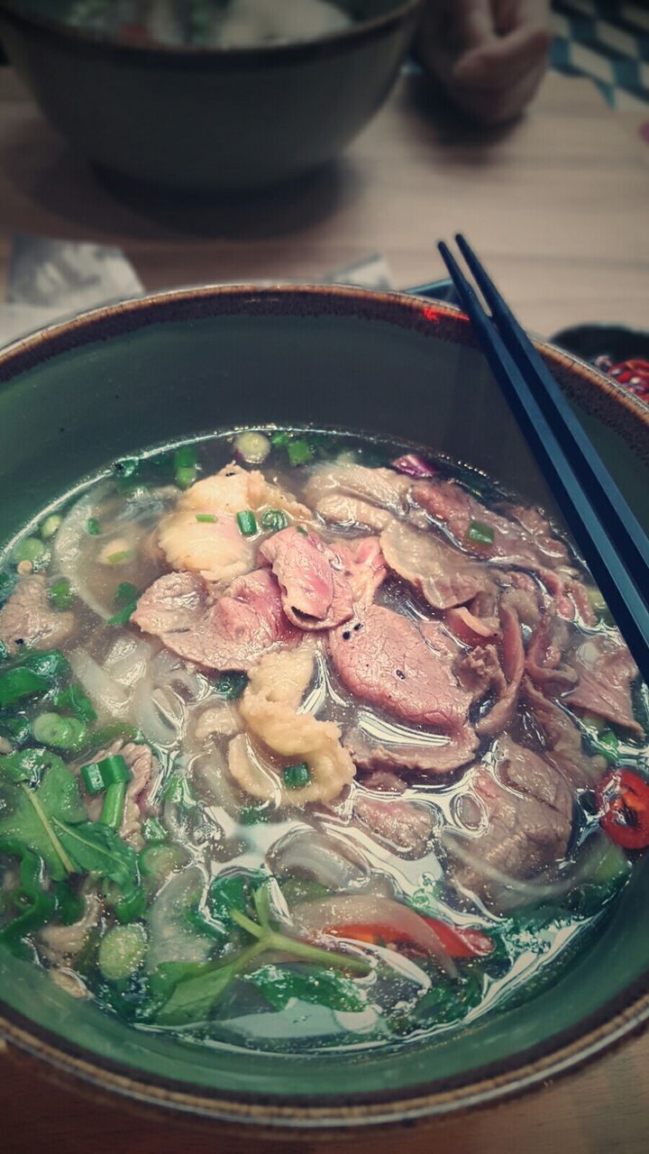 High angle view of miso soup with chopsticks