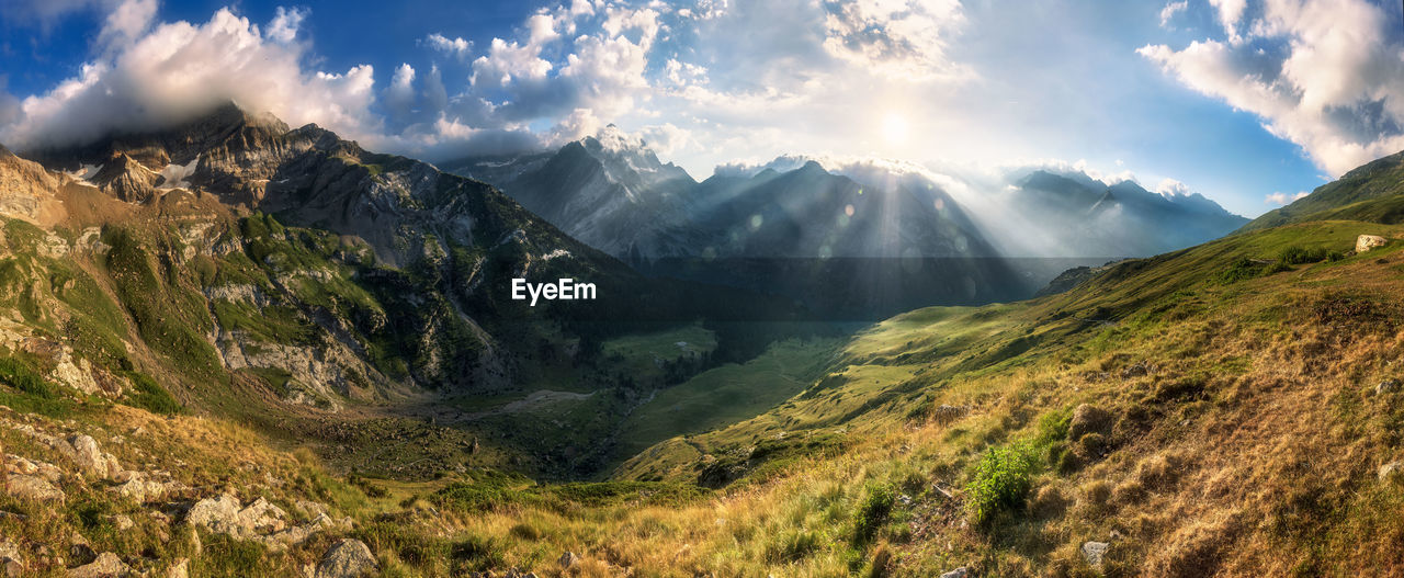 Panoramic view of mountains against sky