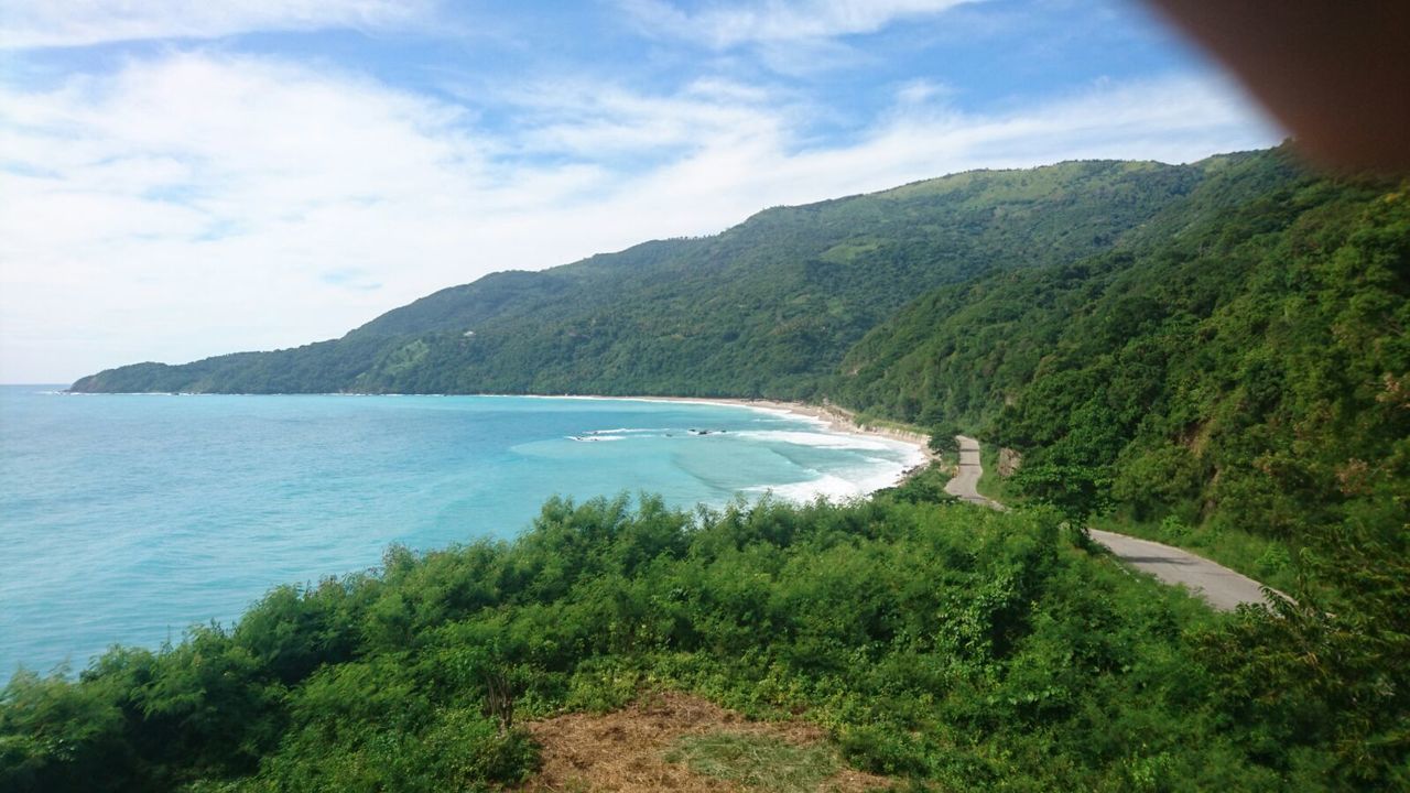 SCENIC VIEW OF SEA AND MOUNTAINS