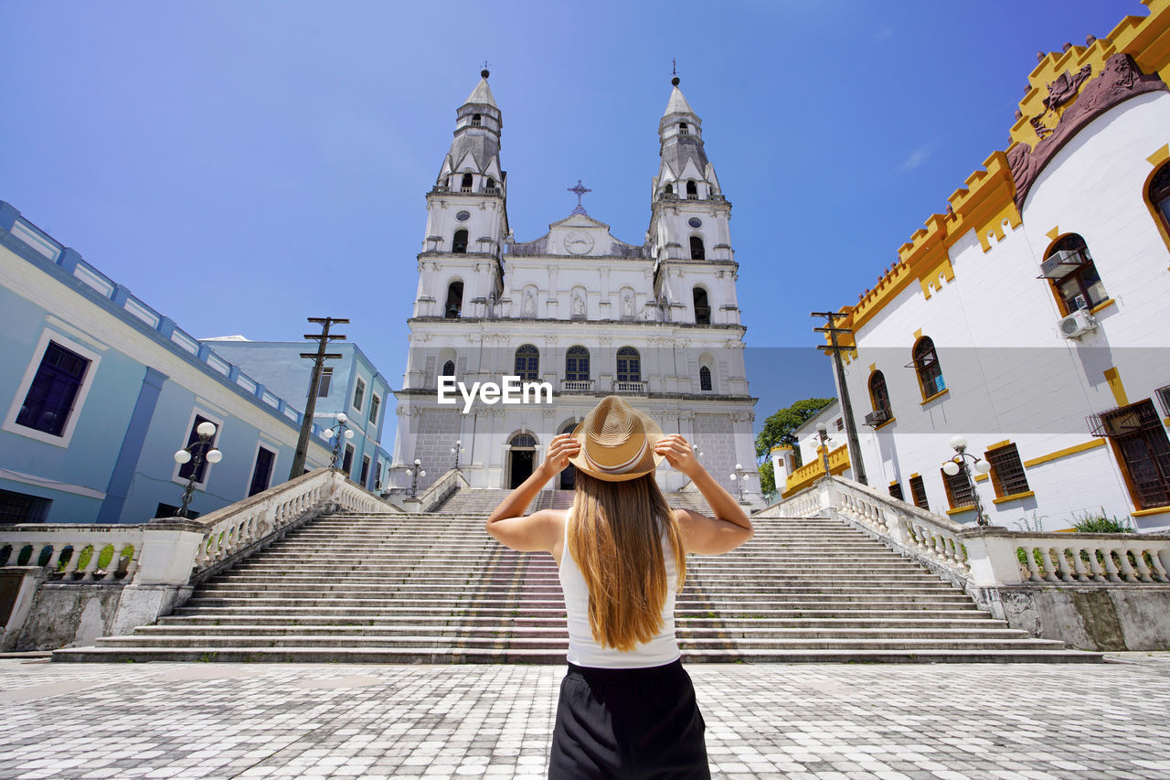 Traveler girl enjoying view of our lady of sorrows basilica in porto alegre rio grande do sul brazil