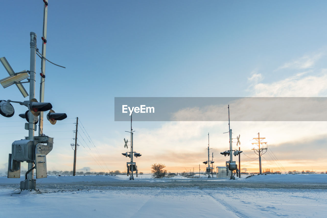 Snow covered railroad crossing during winter