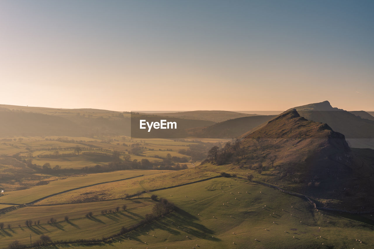 SCENIC VIEW OF MOUNTAINS AGAINST CLEAR SKY