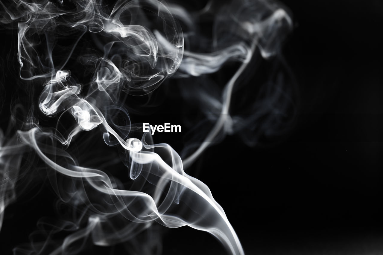 Close-up of smoke against black background