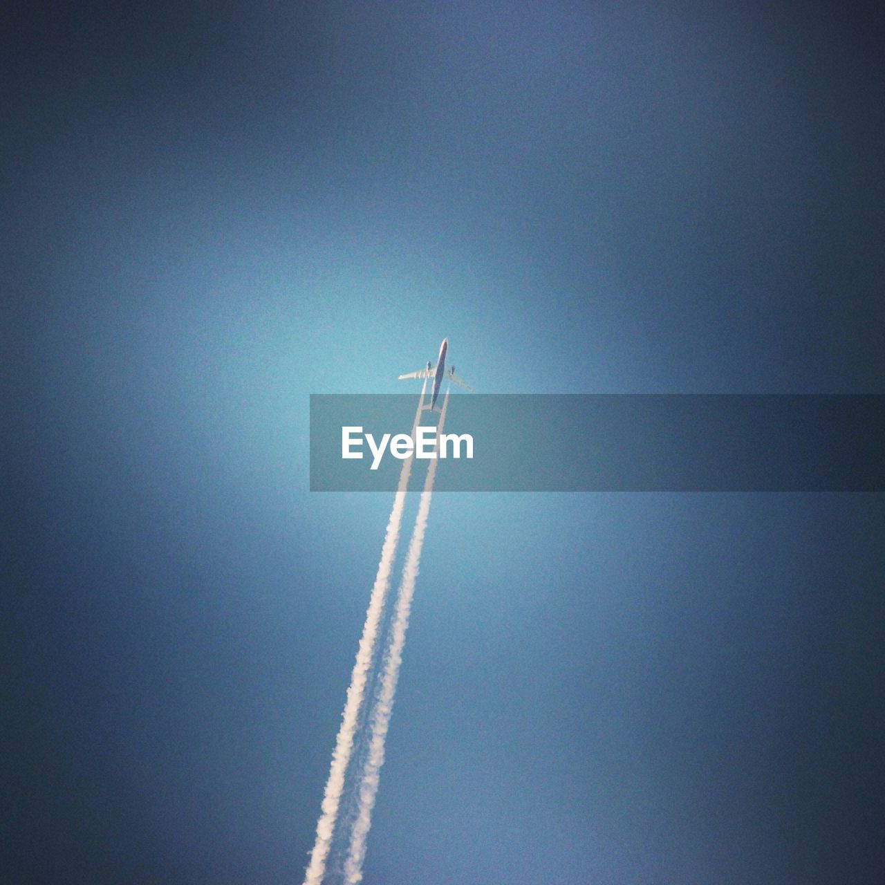 Low angle view of airplane flying against sky