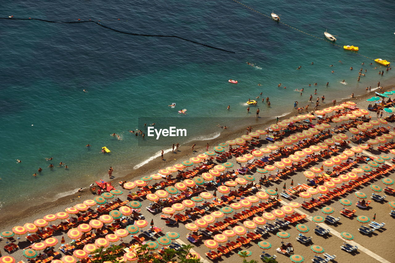 High angle view of people and parasols at beach