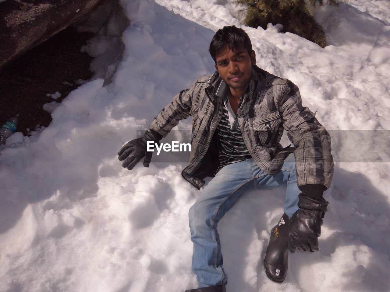 PORTRAIT OF MAN IN SNOW COVERED WITH ICE