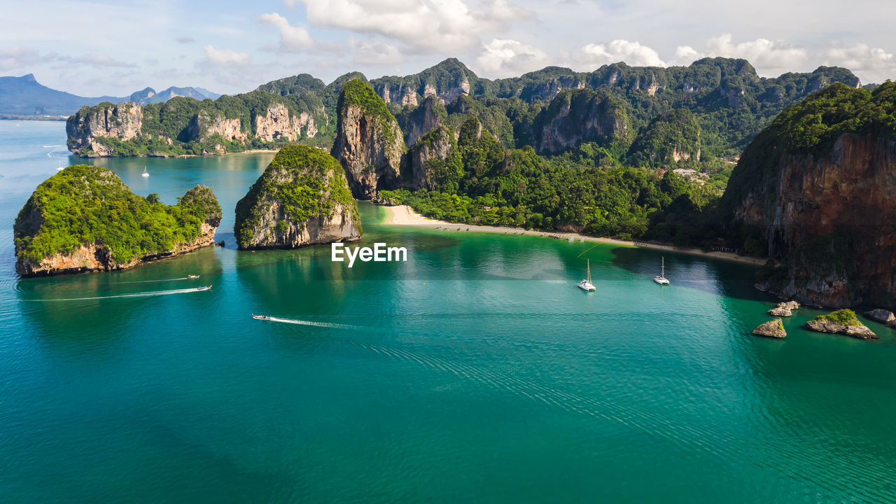 Scenic view of sea and mountains at aonang, railay, krabi, thailand 