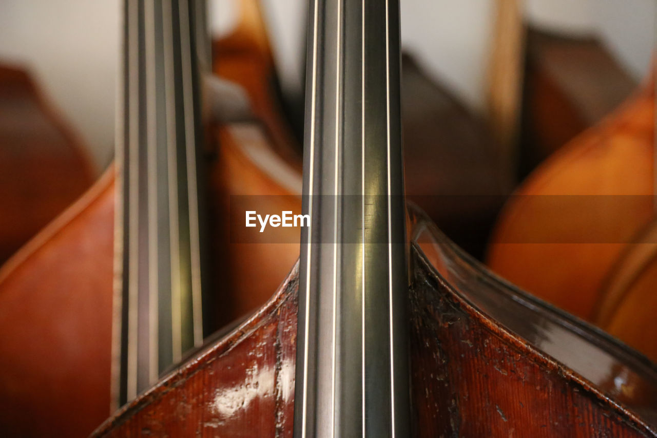 Lots of double basses at a luthier's