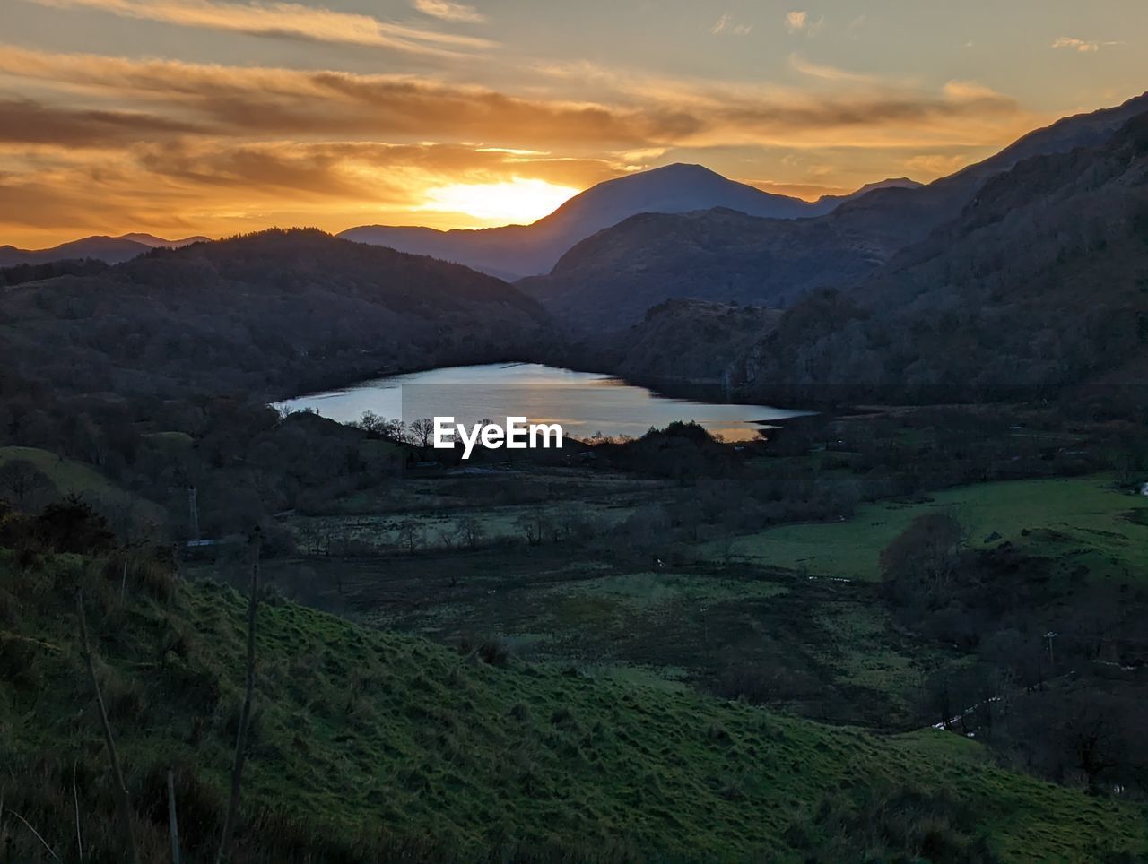 scenic view of landscape against sky during sunset