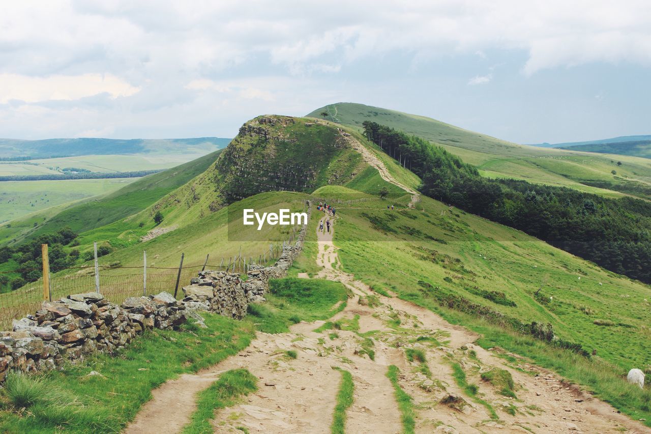 Scenic view of green landscape against sky