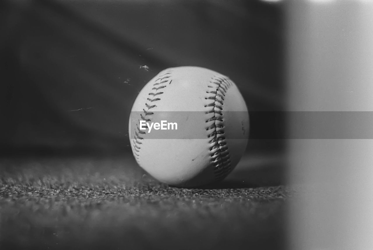 Close-up of baseball ball black and white