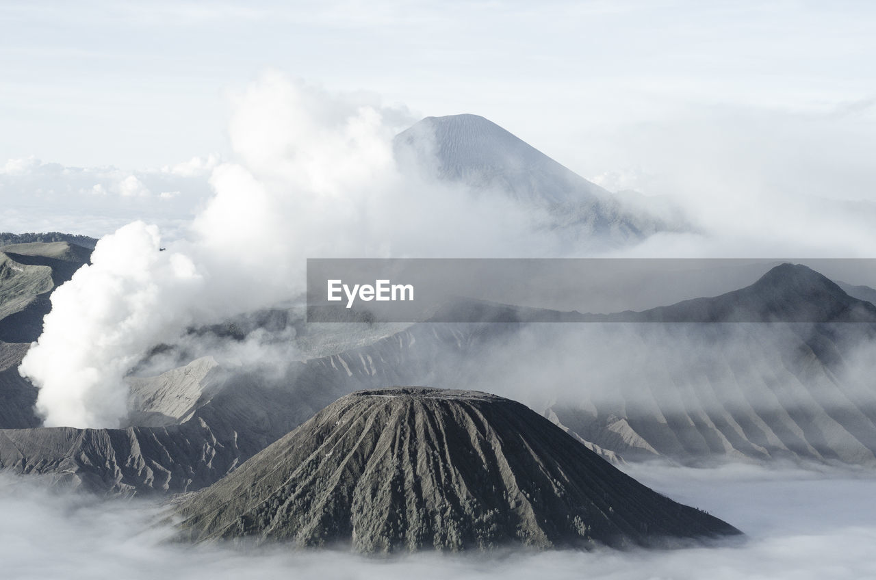 Scenic view of volcano mountains against sky