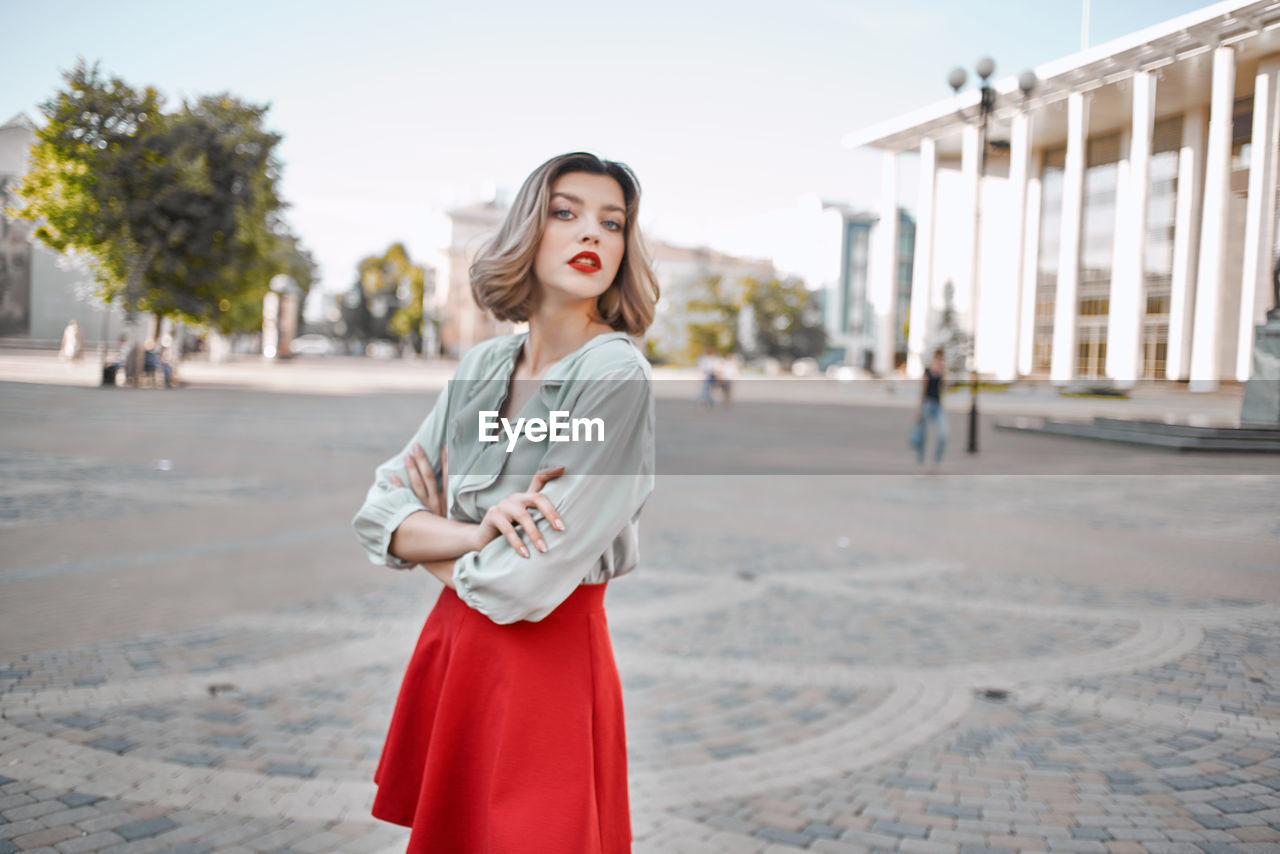 Portrait of young woman standing outdoors