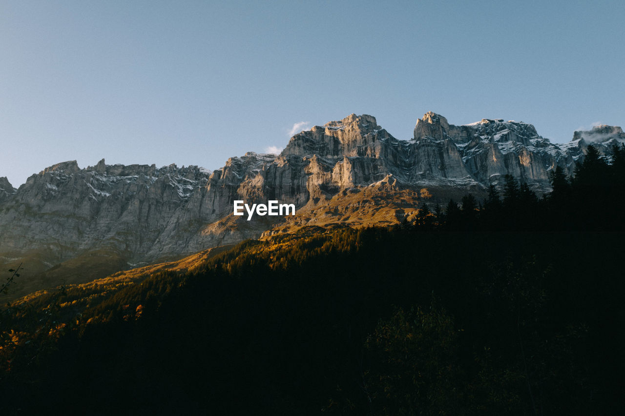 Scenic view of mountains against sky at night