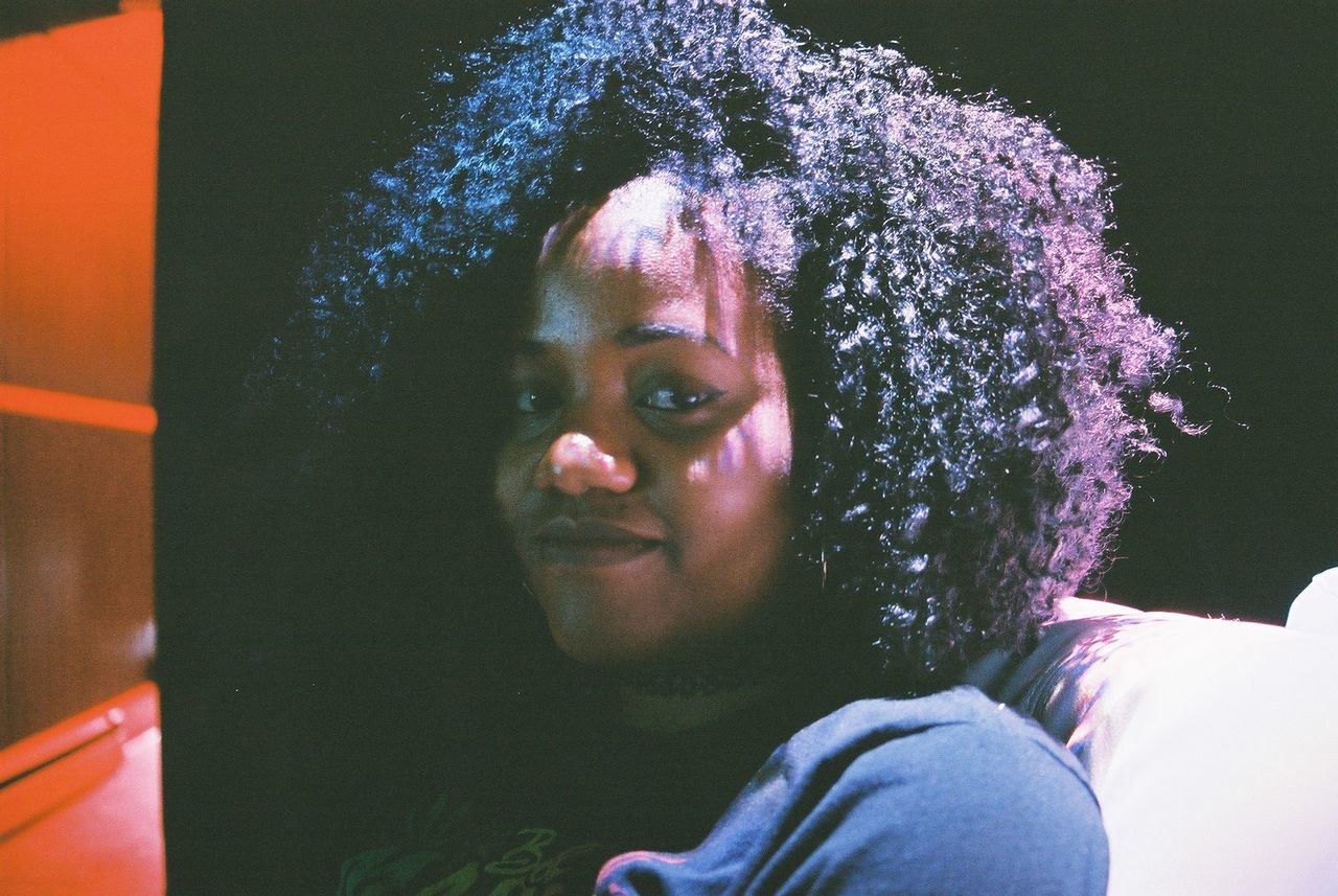 CLOSE-UP PORTRAIT OF SMILING GIRL WITH HAIR