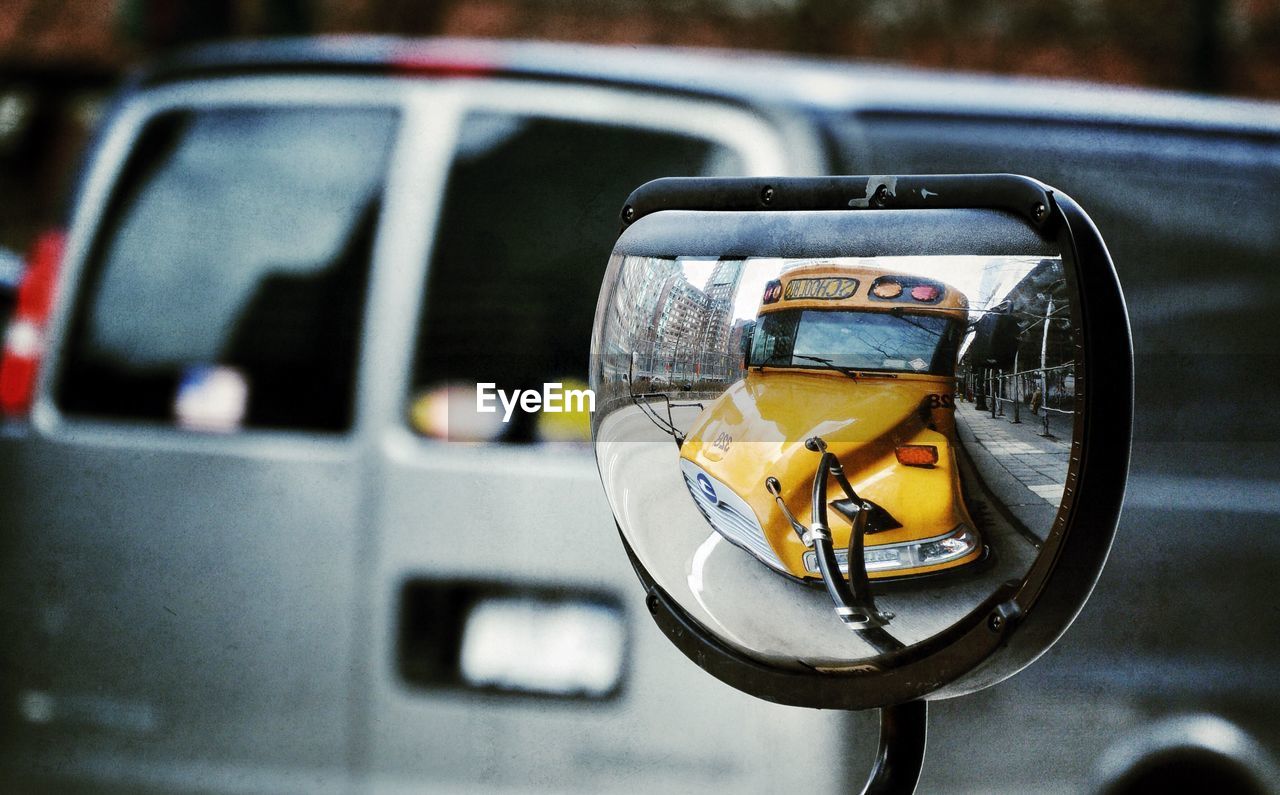 CLOSE-UP OF CAR ON ROAD