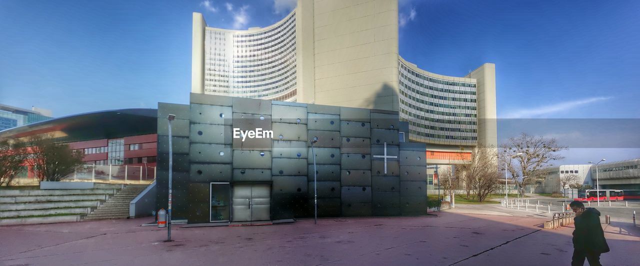 MODERN BUILDINGS AGAINST BLUE SKY