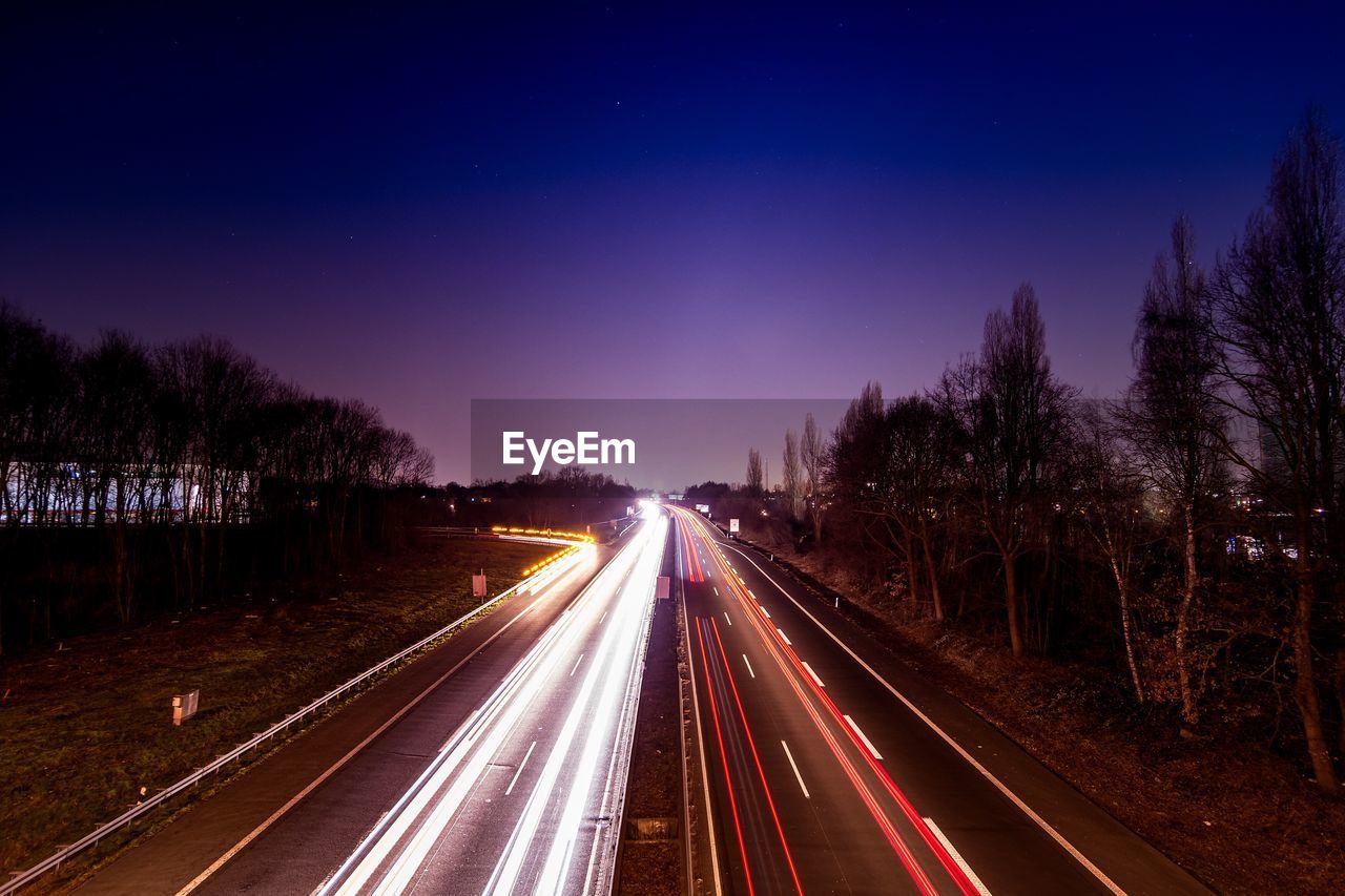 Light trails on road at night