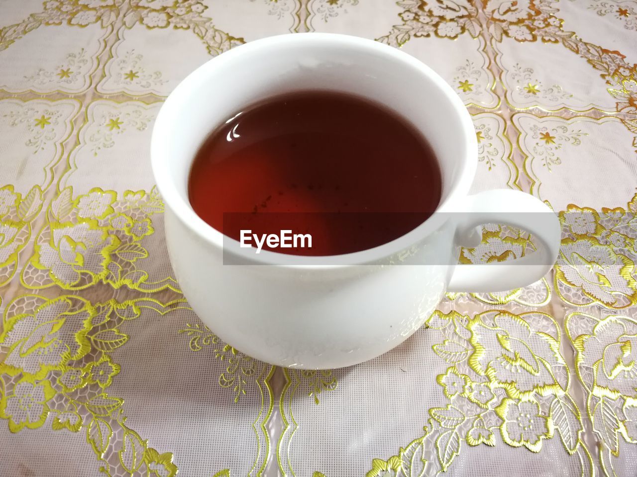 mug, food and drink, cup, drink, tea cup, tea, assam tea, crockery, hot drink, refreshment, coffee cup, indoors, saucer, da hong pao, pattern, porcelain, food, high angle view, studio shot, no people, coffee, table, ceramic, black tea, floral pattern, wellbeing, darjeeling tea, freshness