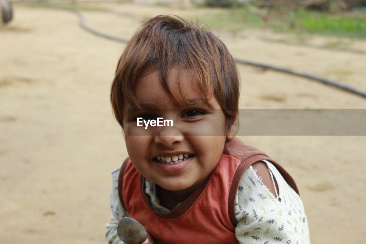 Portrait of cute smiling girl outdoors