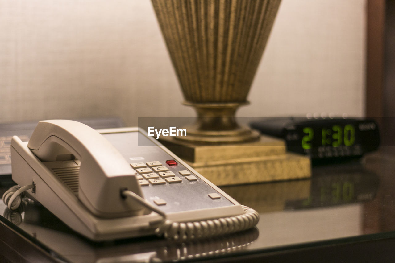 Close-up of telephone on table