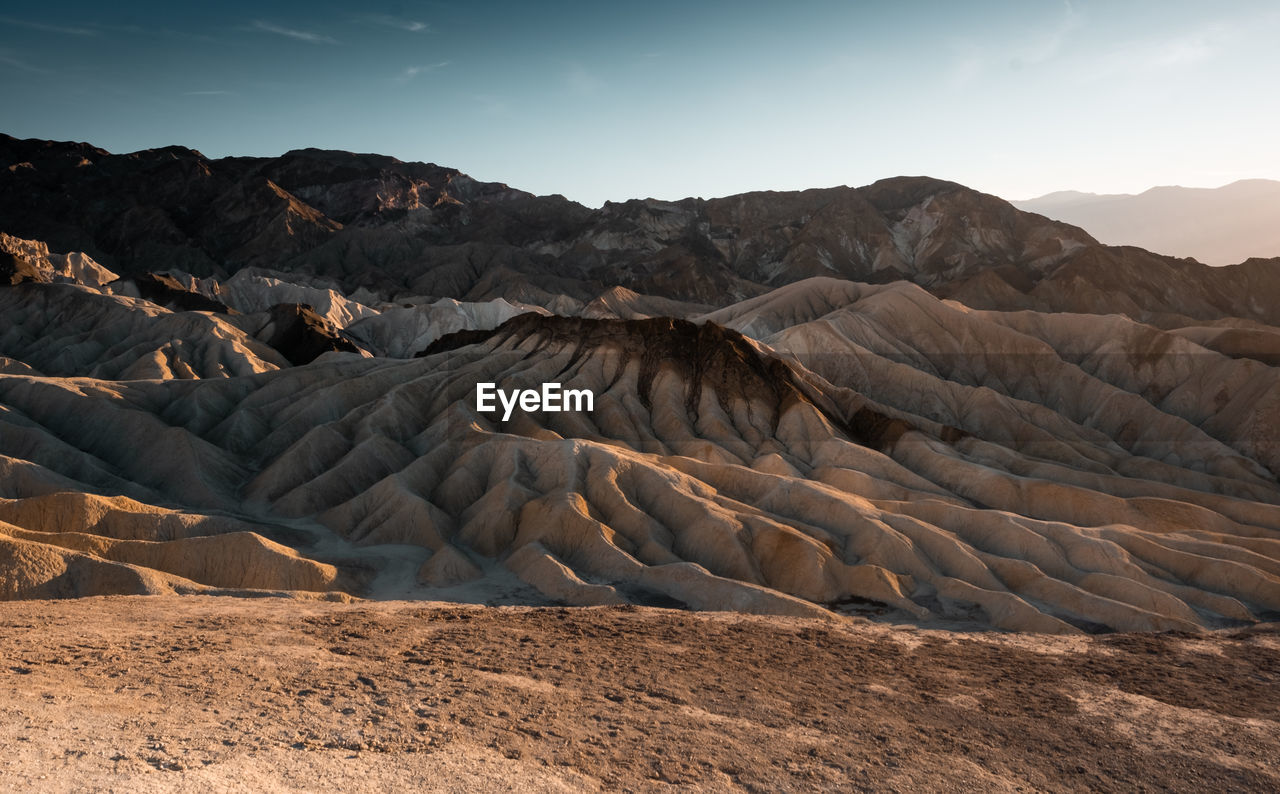 Scenic view of arid landscape against clear sky