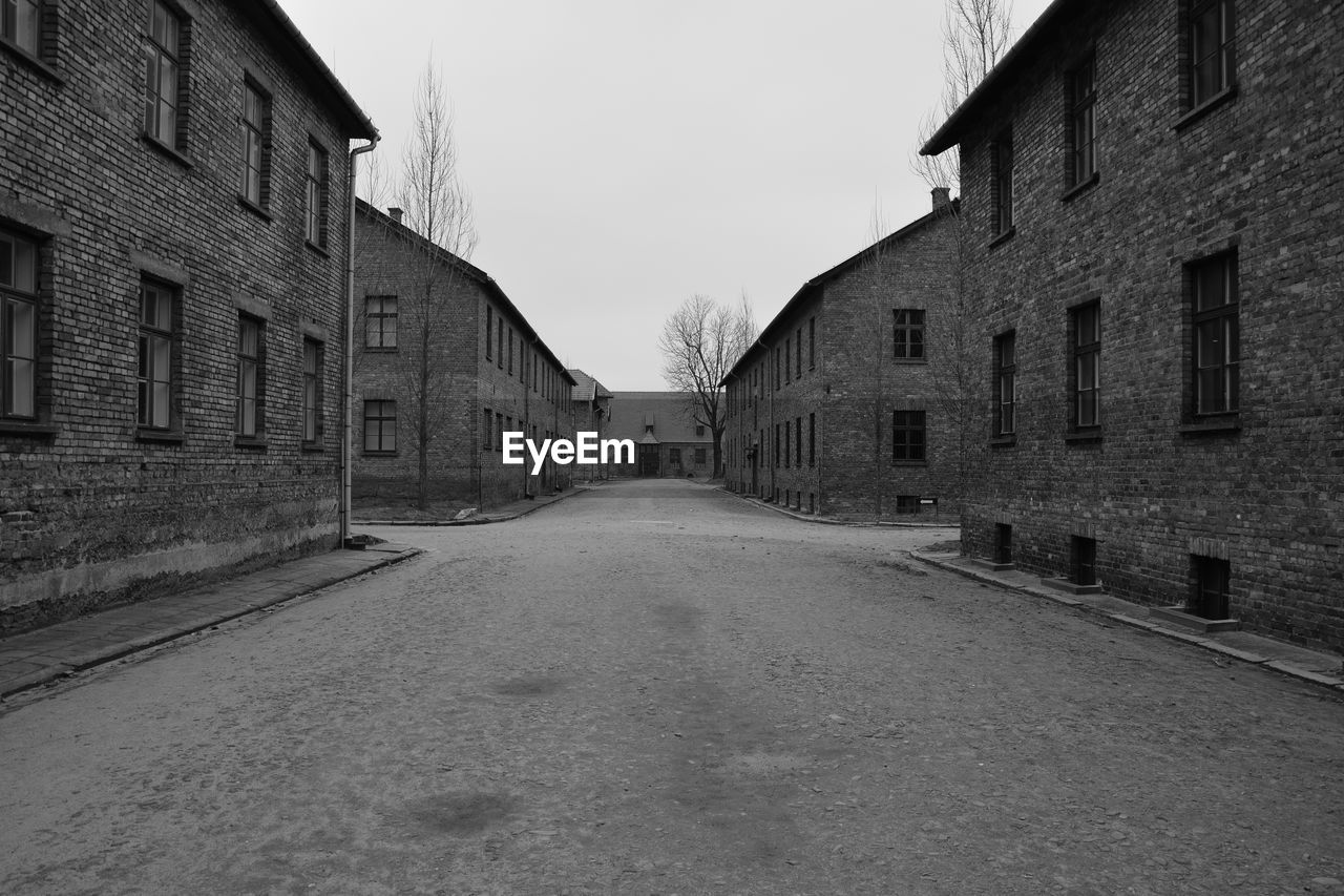 EMPTY ROAD ALONG BUILDINGS