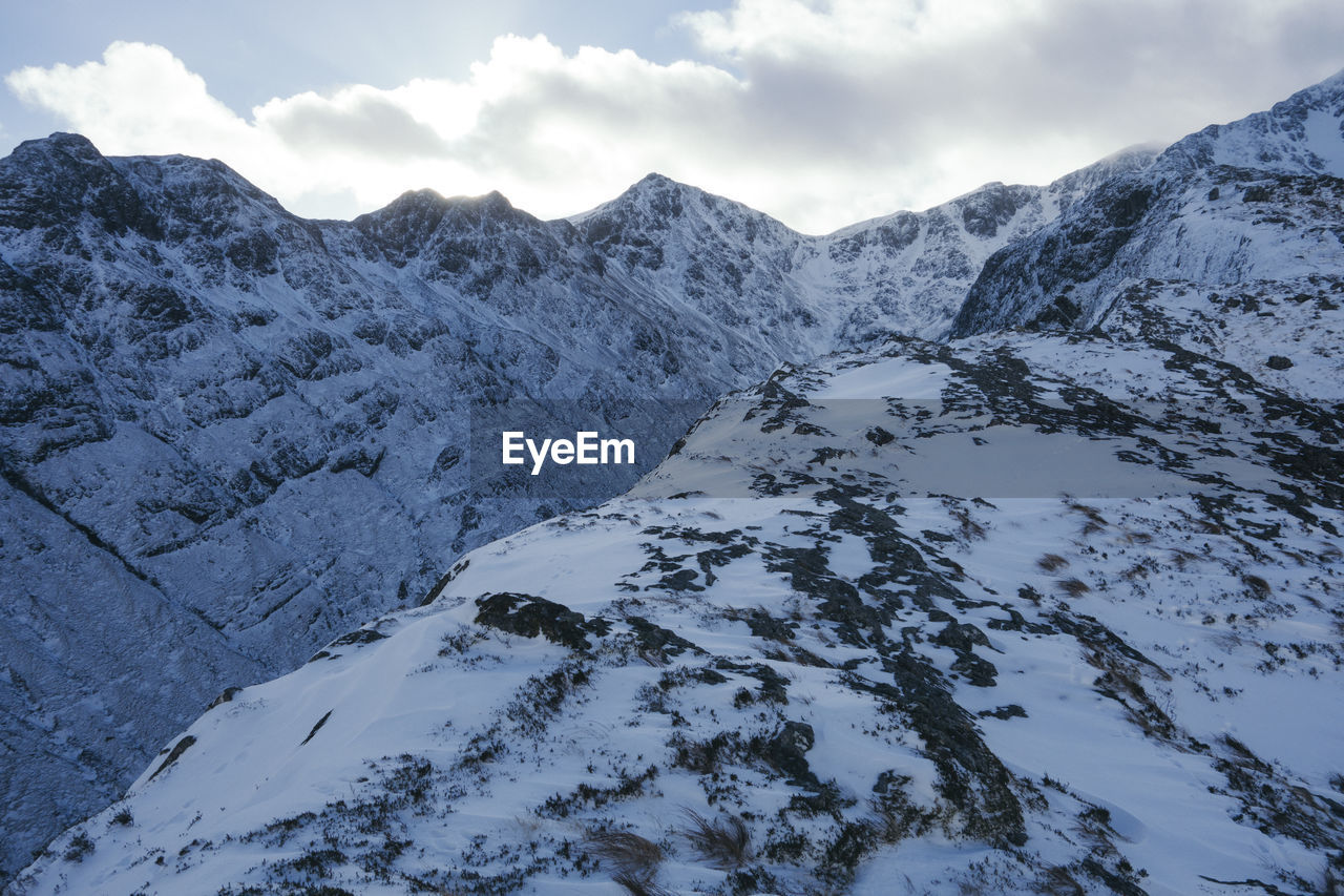 Scenic view of mountains against sky during winter