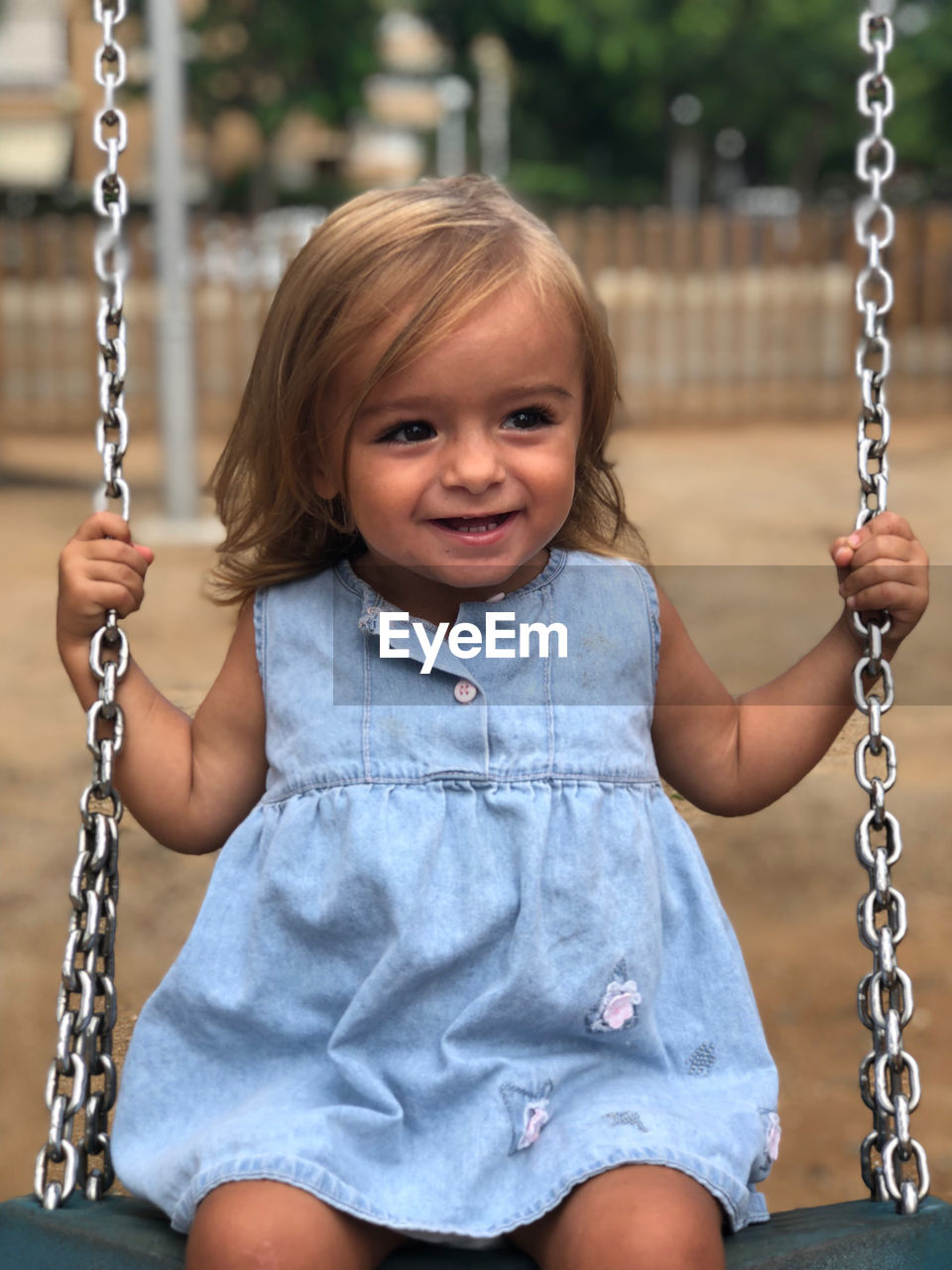 Girl swinging at playground