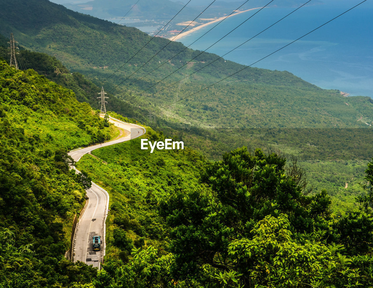 High angle view of road by mountain against sky