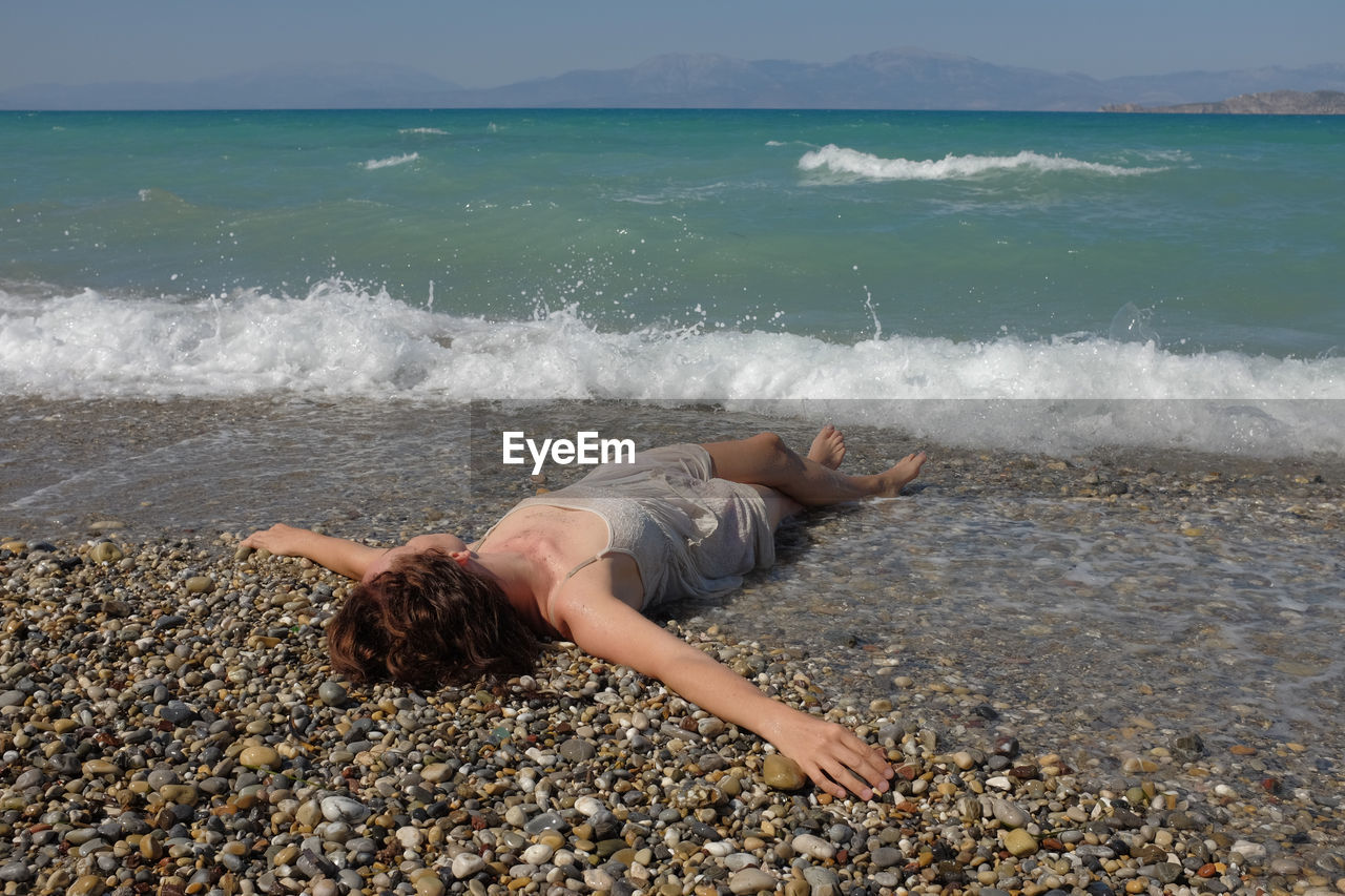 Woman lying at beach