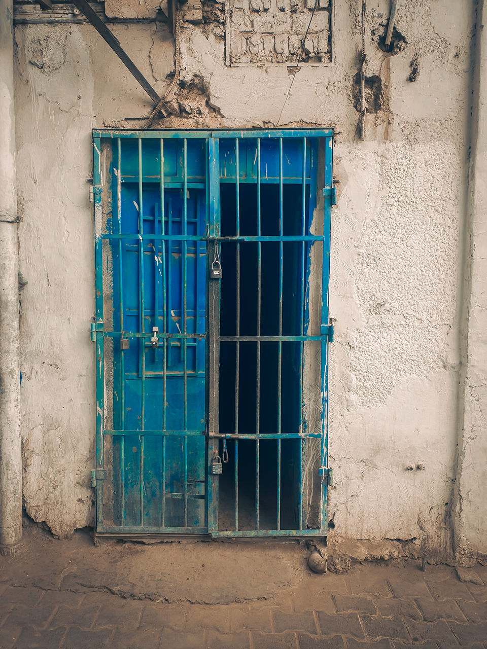 CLOSED BLUE DOOR OF BUILDING