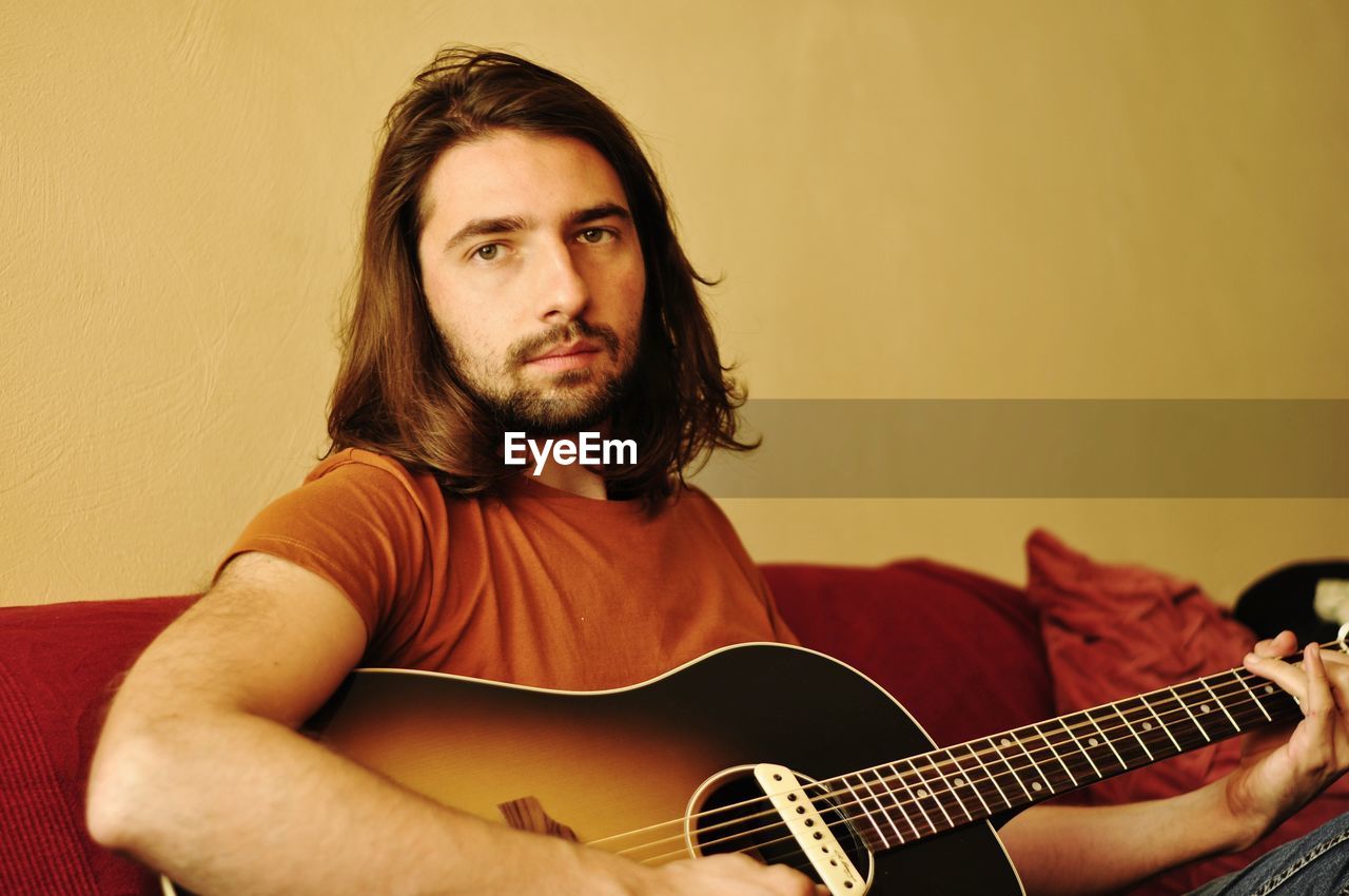 Young man playing the guitar