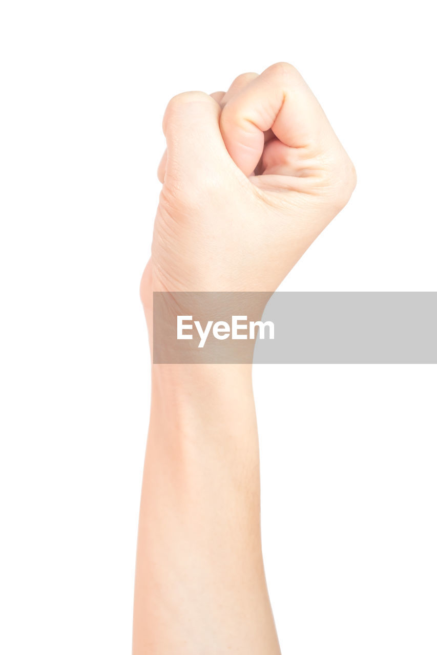 Close-up of hand gesturing against white background