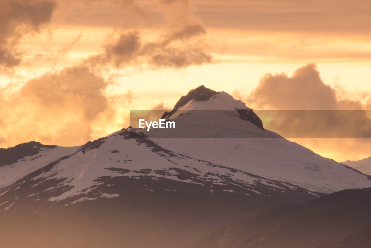 Scenic view of mountain against sky during sunset