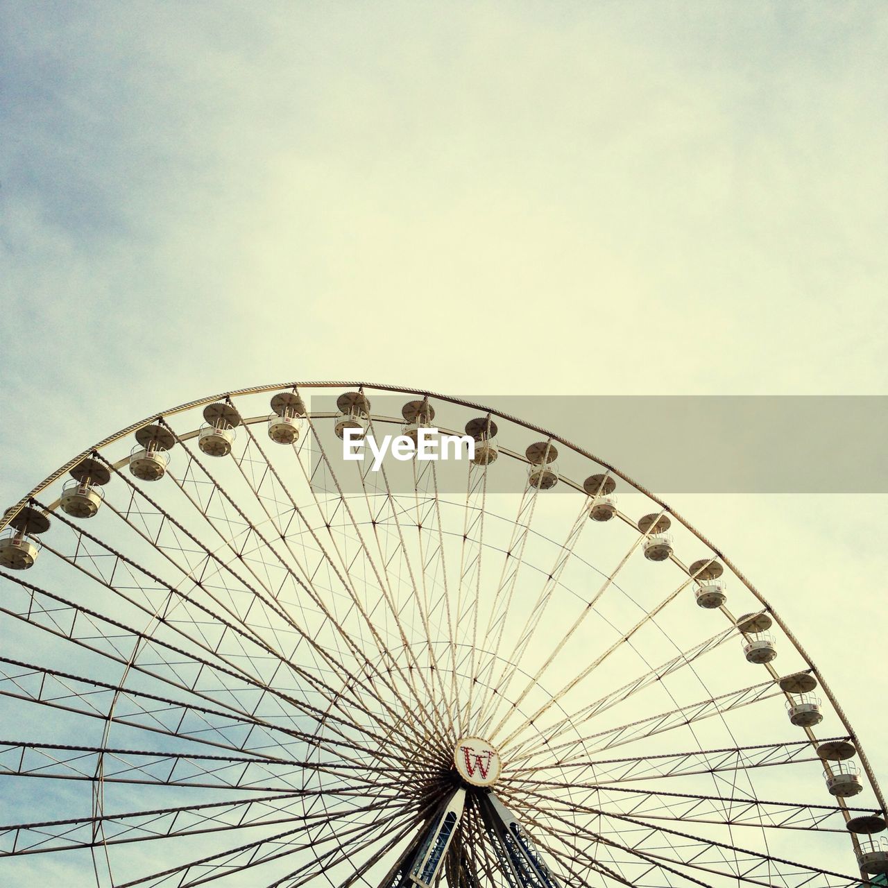 Low angle view of ferris wheel against sky