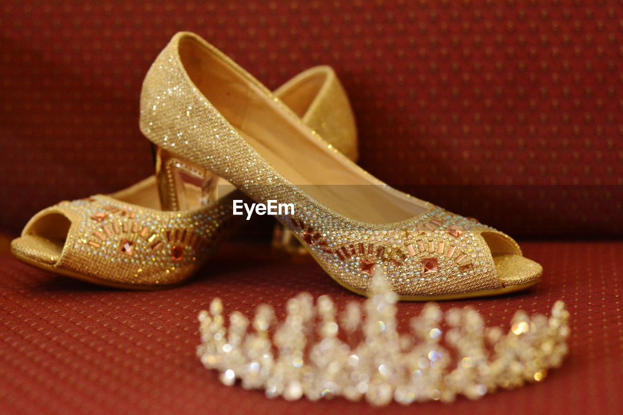 Close-up of high heels and tiara