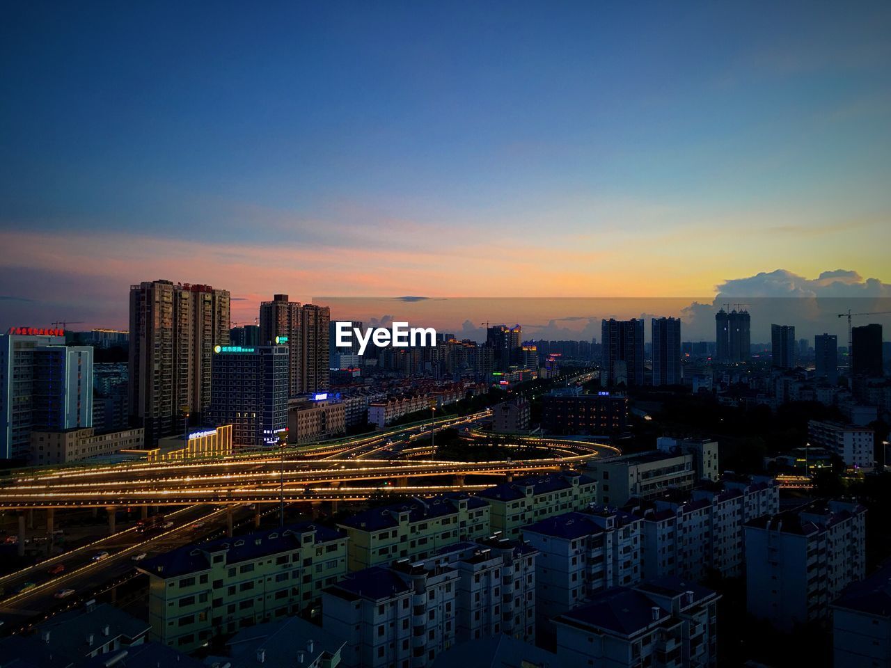 Cityscape against sky during sunset